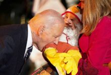 Photo of Biden bites babies visiting for White House Halloween trick-or-treat celebration