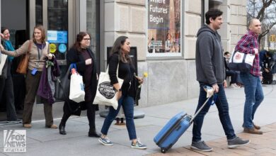 Photo of ‘Fired me illegally’: Emotional ex-USAID employees leave building with belongings after mass layoffs